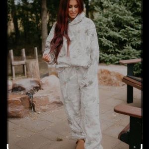 Chelsea Deboer in the woods camo set